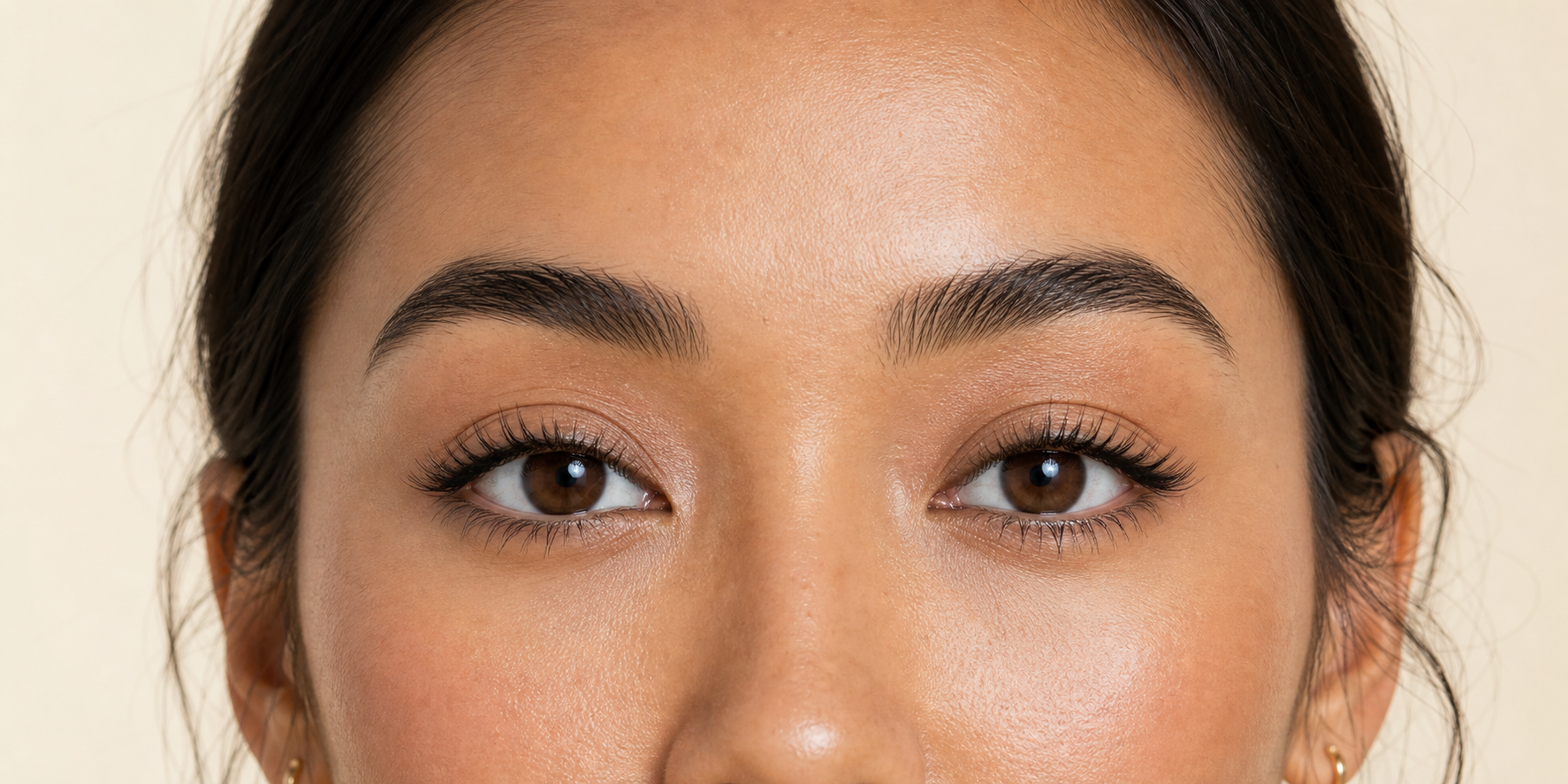Soft-glam cluster lashes enhancing almond-shaped hooded eyes